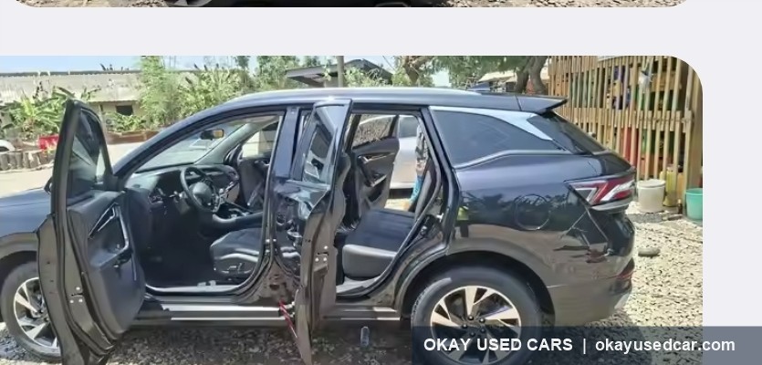Delivered black SUV with doors open at the customer site